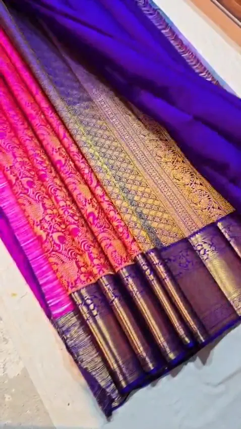 Video of the pink & purple kanchipuram handloom silk saree showing the drape and zari