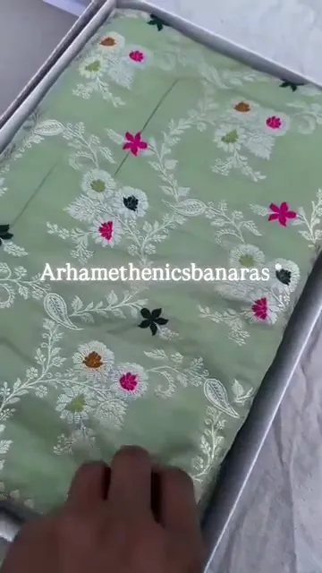 Video of the pista green banarasi meenakari jangla mashru silk saree showing the drape and zari