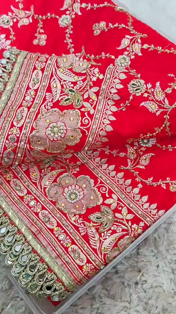 Video of the red floral banarasi mashru silk dardozi saree showing the drape and zari