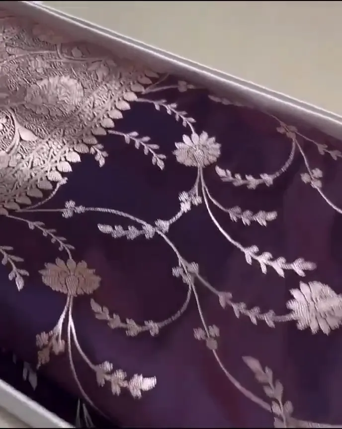 Video of the wine banarasi mashru silk jaal saree showing the drape and zari